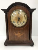 A circa 1900 American mahogany cased mantel clock with eight day movement,