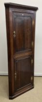 A 19th Century oak free-standing corner cupboard,