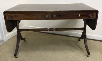 An early 19th Century rosewood and cross-banded drop-leaf sofa table with single drawer and dummy