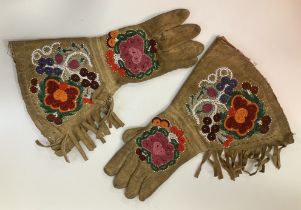 A pair of native American beadwork decorated chamois leather gloves or gauntlets,