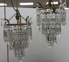 A pair of glass lustre and brass bag lights