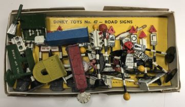 A Road Signs 47 vintage box containing various road signs, oil dispenser unit, two traffic lights,