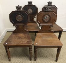 A set of four 19th Century oak hall chairs,