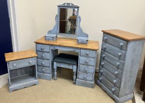 A pale blue painted and polished pine bedroom suite comprising kneehole dressing chest with