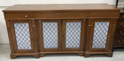 A 20th Century mahogany breakfront sideboard in the Empire style,