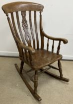 A modern beech, ash and elm Windsor type rocking armchair, signed to underside of seat "D Tubb", 59.