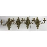 A set of four 20th Century brass twin light wall candle sconces in the Baroque style with Bacchus