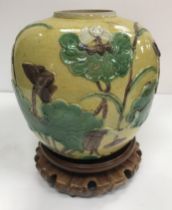 A Chinese enamelled "Crane and lotus" moulded jar with green,