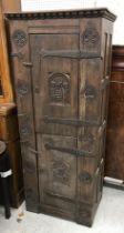 A mid 20th Century oak cupboard in the 17th Century Flemish style,