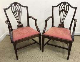 A circa 1900 set of eight mahogany framed Hepplewhite style dining chairs in the 18th Century