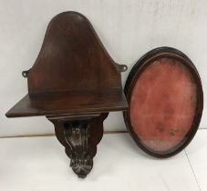 A mahogany wall bracket with scrolling acanthus decorated support,