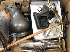 A box of various cutlery, pewter water jug, brass and turned wood coat hanger,