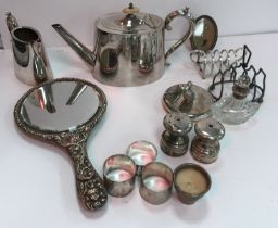 A box containing various plated wares including tea pot and milk jug, two toast racks,