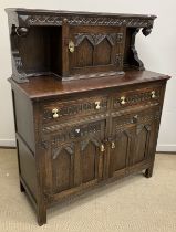A mid 20th Century oak court cupboard in the 17th Century style,