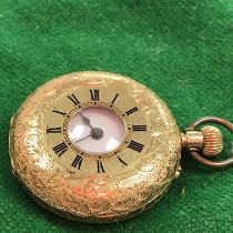 An 18 carat gold foliate engraved cased lady's pocket or fob watch,