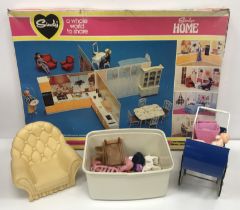 Two boxes of assorted Sindy furniture and other related items to include a boxed Sindy's home,