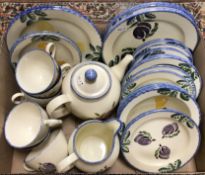 A quantity of Poole Dorset fruit spongeware decorated dinner wares to include plates, bowls,