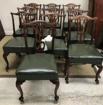 A set of ten Victorian dining chairs in the Chippendale style with pierced back splats,
