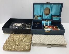 A box containing a quantity of various costume jewellery, two paste decorated evening bags,