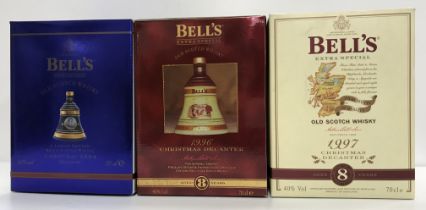 A collection of seventeen Bells Extra Special Old Scotch Whisky limited edition Christmas decanters
