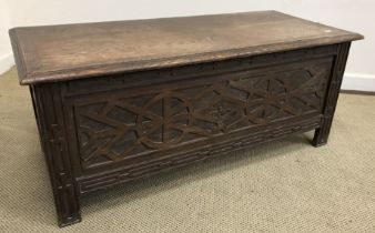 A 19th Century oak coffer of small proportions, the top above a carved panel,