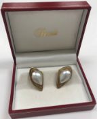 A pair of 9-carat gold and pearl ear stu
