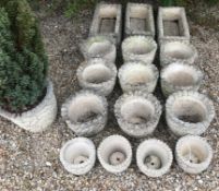 A collection of nine reconstituted stone acorn and oak leaf decorated circular planters together