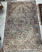 A Persian wool and silk rug, the central