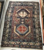 A Caucasian rug, the central panel set w