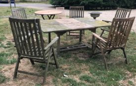 A teak garden table together with five folding chairs CONDITION REPORTS Table is in
