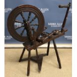 A Victorian fruit wood spinning wheel of