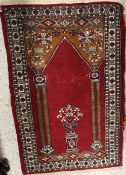 A Bokhara rug the central panel set with