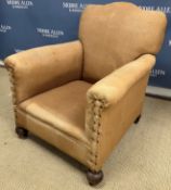 A circa 1900 upholstered arm chair on sq