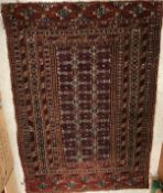 A Bokhara rug, the central panel set wit