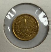 A United States gold $1 coin, 1852, tiar