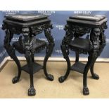 A pair of ebonised urn stands in the Cla