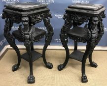 A pair of ebonised urn stands in the Cla
