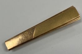 A 14-carat gold tie clip of plain form w