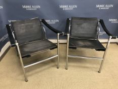 A pair of chrome framed LC1 chairs with