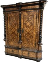 A 17th Century German walnut and inlaid Kas, the moulded cornice above a lattice work decorated