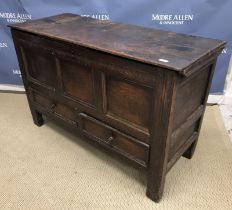 An 18th Century oak mule chest, the two plank top with moulded edge opening to reveal a candle box