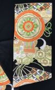 A late 20th Century Japanese obi belt with orange, green, white and gold fan and floral