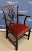 A 19th Century Chippendale design mahogany carver chair, the shaped back with pierced back splat