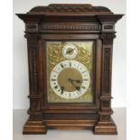 A circa 1900 German carved oak cased mantel clock, the eight day movement by Lenzkirch stamped to