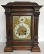 A circa 1900 German carved oak cased mantel clock, the eight day movement by Lenzkirch stamped to