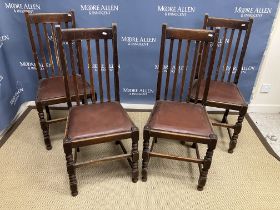 A set of four early 20th Century oak dinning chairs with bobbin turned front legs together with a