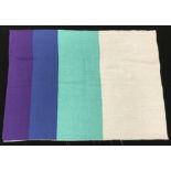 An Althea McNish design fabric sample in purple, blue and aqua through aqua, green and white