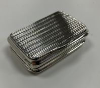 A 19th Century silver snuff box of fluted / reeded rectangular form with waisted sides, opening to