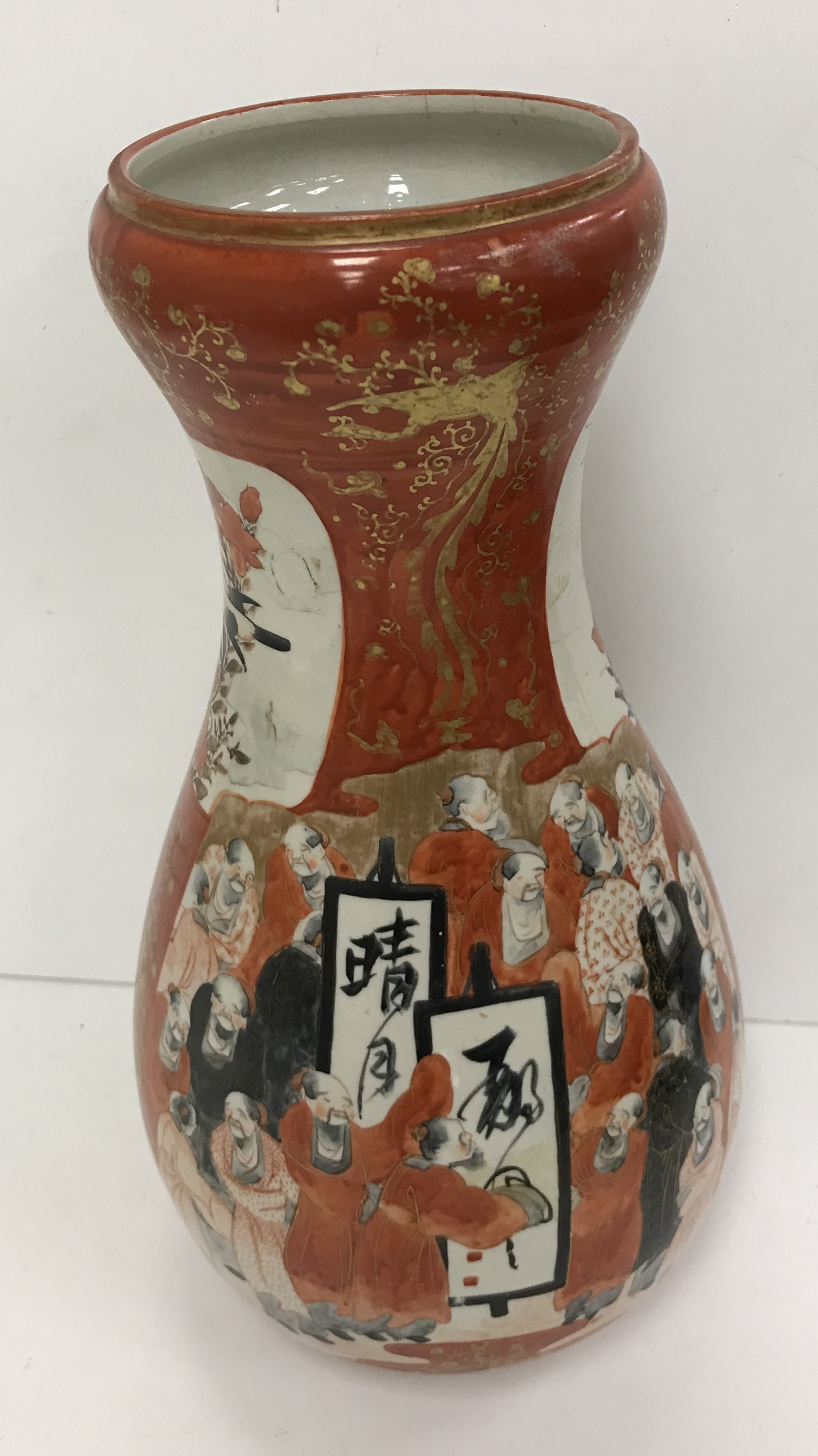 A Japanese Meji period kutani oxide red palette and gilt decorated gourd shaped vase, the main