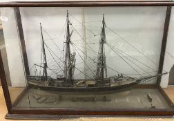 A scale model of the three-masted vessel ''Albert'' within a glazed five-sided display case (back